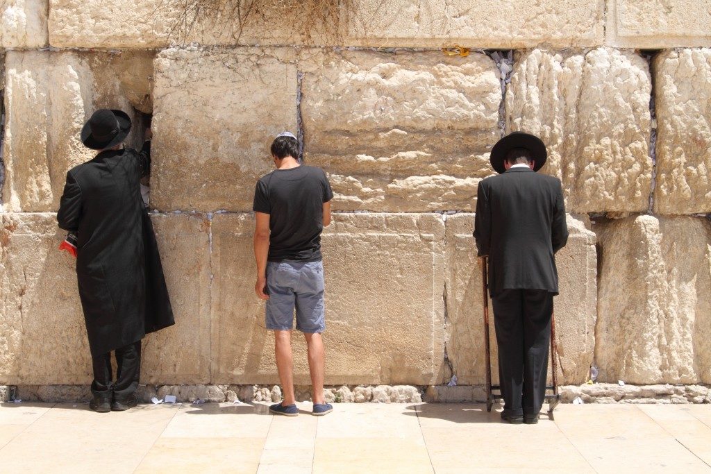 Men praying at the jerusalem wall