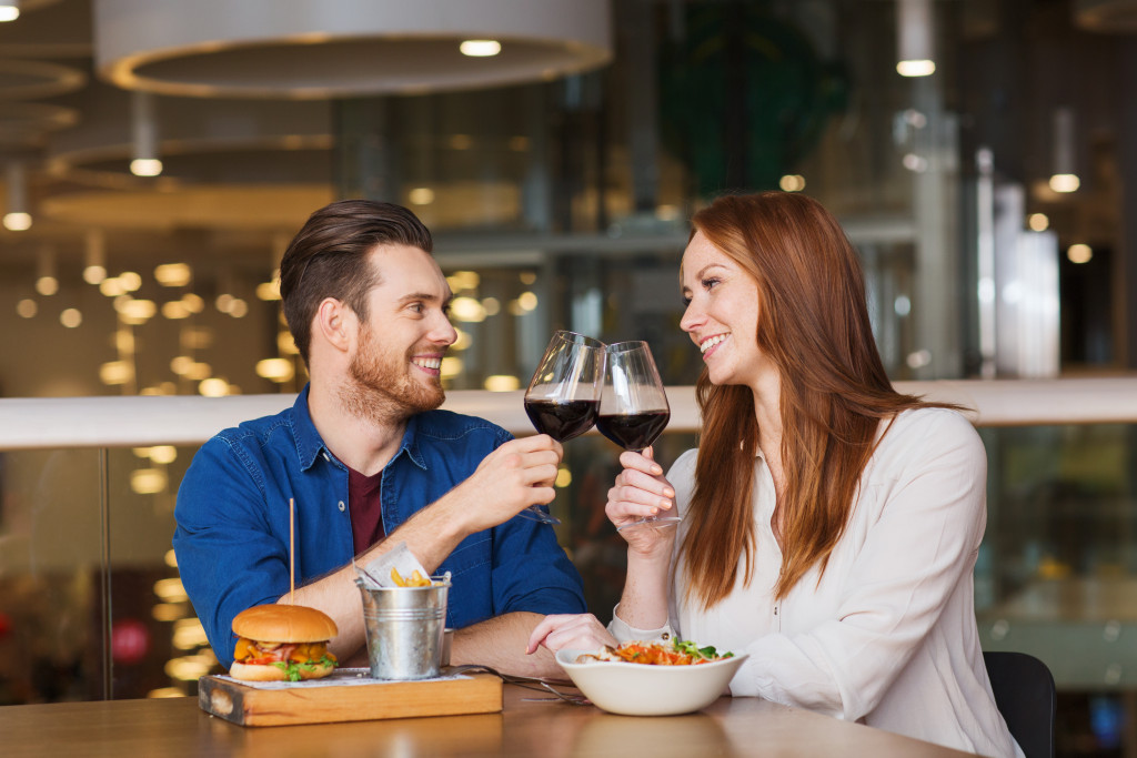 A couple drinking wine on a restaurant date