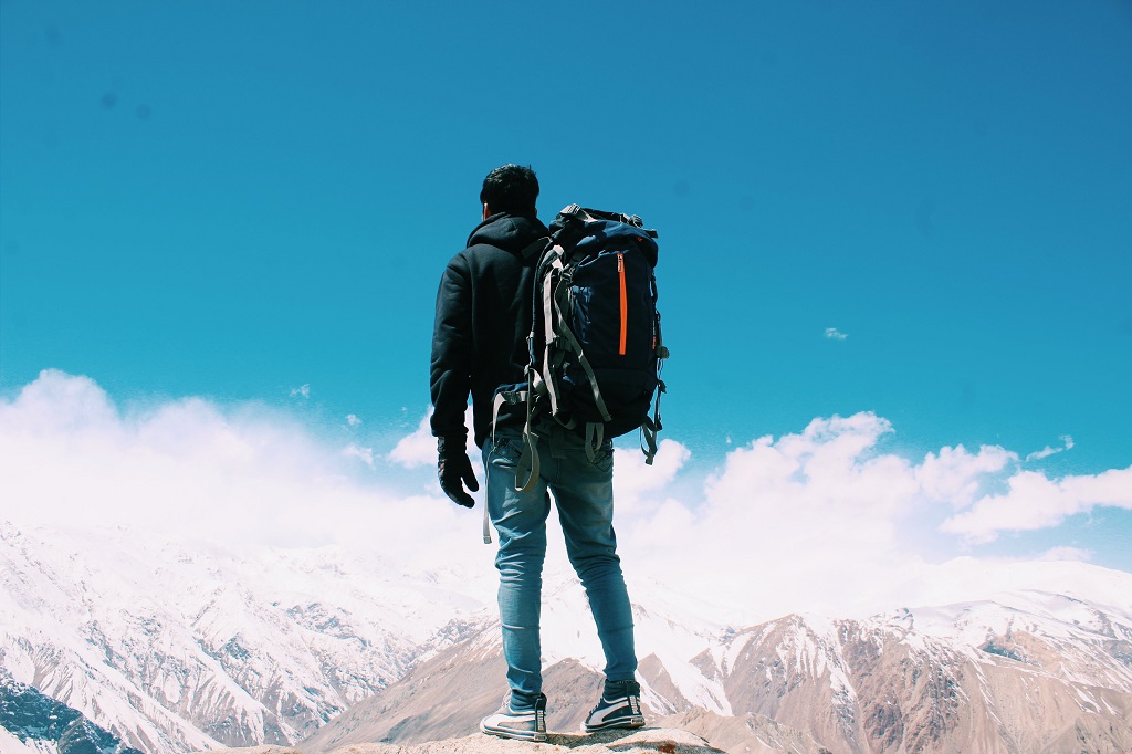 Backpacker admiring mountain range